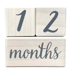 Pondering Pine milestone blocks closeup with rounded corners for baby-friendly design.