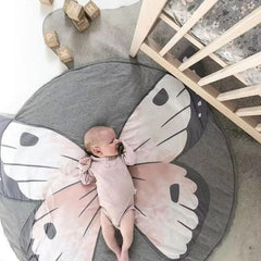 Poowe Butterfly Round Play Pad with animal pattern adds playful nursery decor.