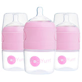 PopYum 5oz pink bottle with slow-flow nipples for easy feeding on the go.