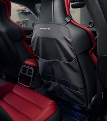 Porsche cargo organizer in use behind seat keeps small items accessible