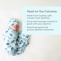 Close-up of Posh Peanut Enzo swaddle wrap fabric texture and stretchiness.