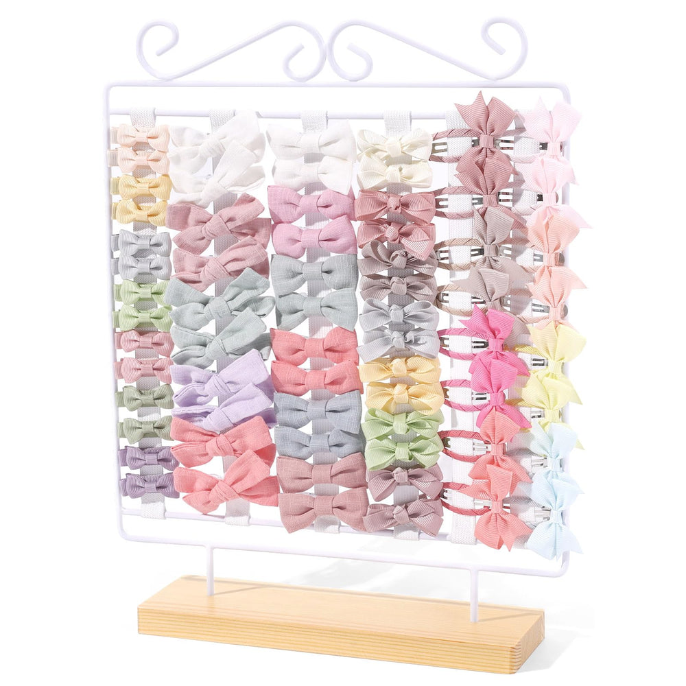 POVETIRE bow-holder-base keeps baby bows organized on a natural wood base.