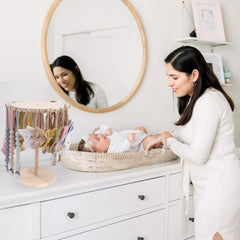 POVETIRE wooden bow organizer for girls adds natural charm while storing hair accessories.