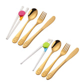 Poylim kids knife with blunt blade for safe self-feeding.