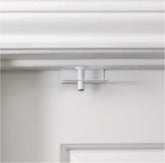 Predictable Solutions GlideLok top-lock on door for dual-sided control.