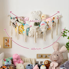 Pretty Jolly tassel accents enhance nursery wall aesthetic.