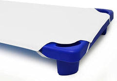 Pure Dreams four-corner elastic close-up showing secure fit on a toddler cot.