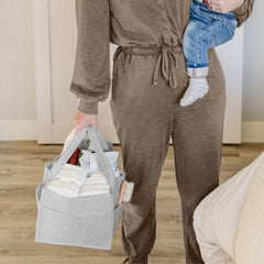 PUTSKA diaper caddy open with removable dividers for customization.