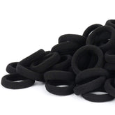 Qarwayoc black seamless hair tie close-up, gentle cotton blend for snag-free ponytails.