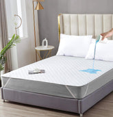 QATAN California King waterproof mattress protector blocks spills and keeps the mattress dry.