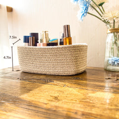 QFLQFL Small Woven Storage Basket for bathroom essentials and towels.