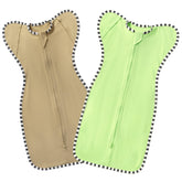 QUENESS BABY transitional swaddle front view in light green and tan for cozy nights