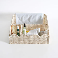 Quincry scalloped wicker baby caddy adds stylish storage for essentials.