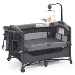 QUTANIX baby bedside bassinet side-sleeper for close nighttime nursing proximity.