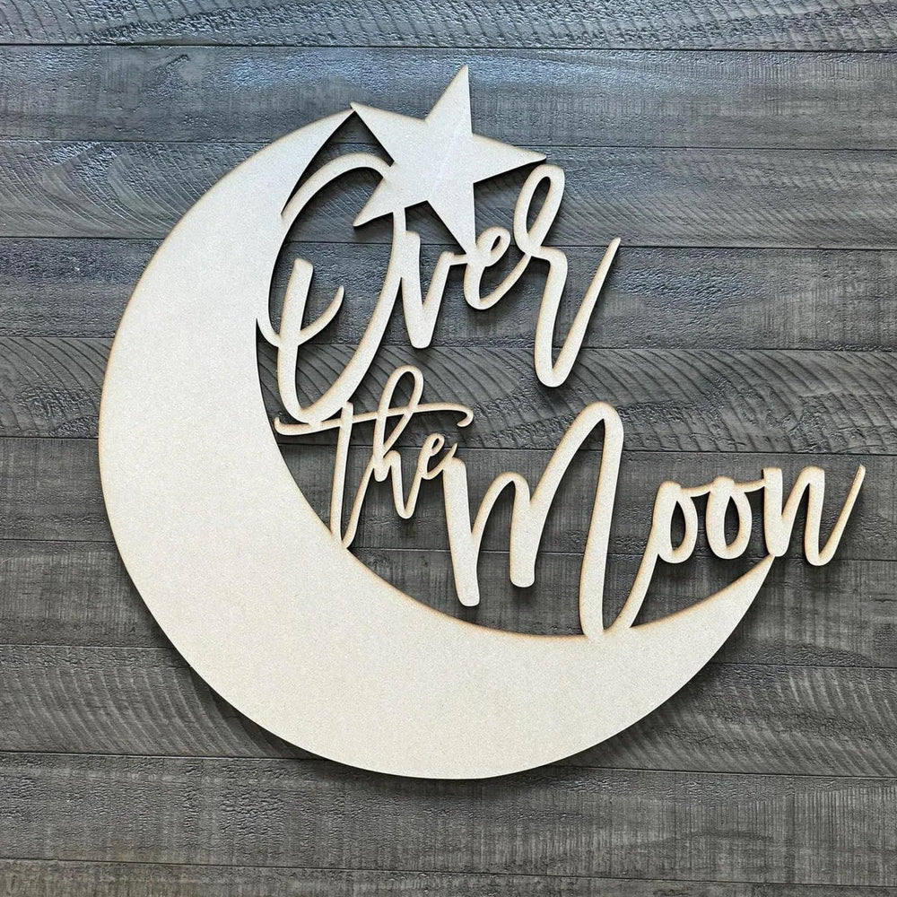 QWTOWFM Over The Moon sign backdrop in warm wood for rustic photo moments.