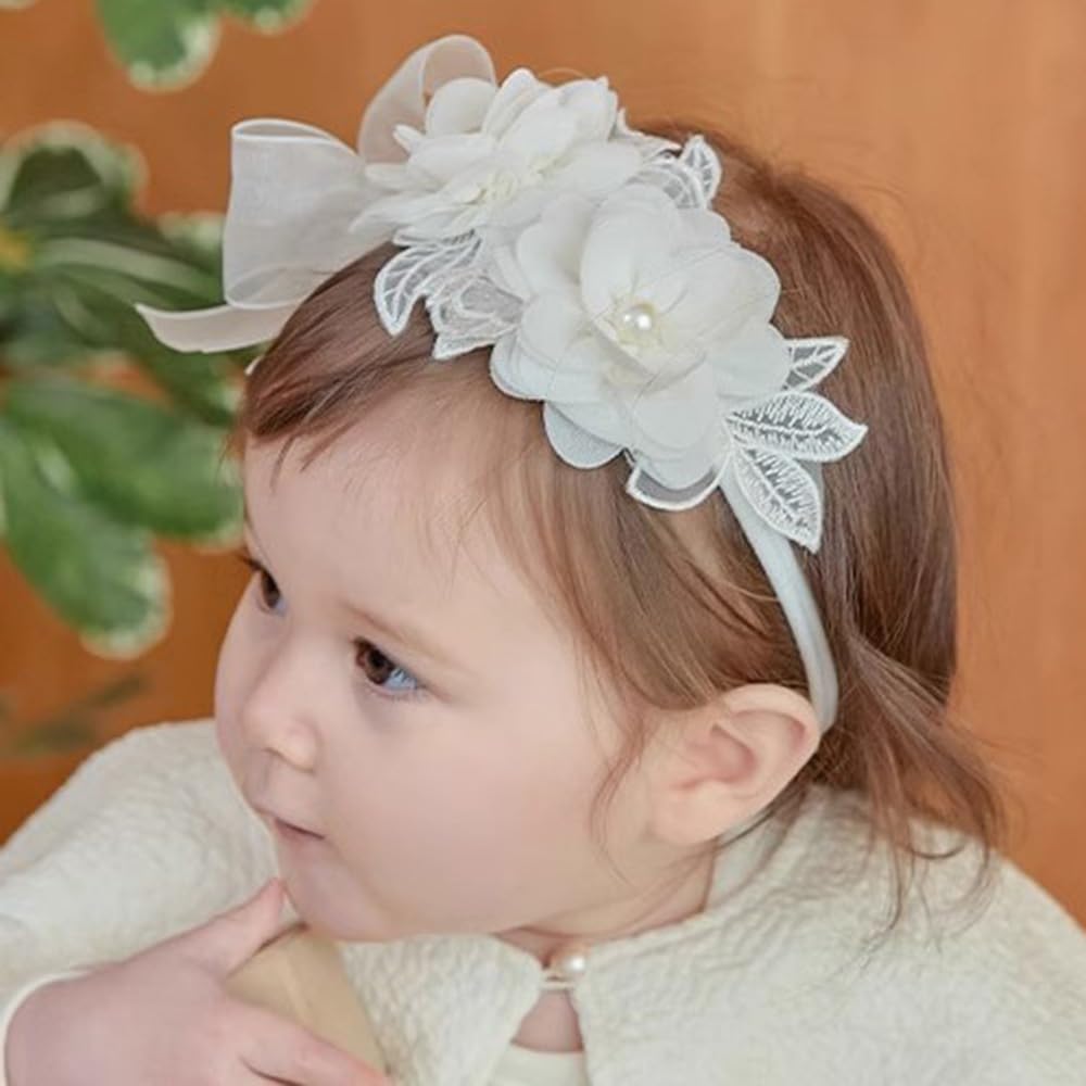 Rannyrena floral lace hair bow in ivory on baby for a sweet look
