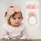 Rannyrena lace bow headband in white offers gentle elastic for comfy, photogenic baby looks.