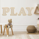 RattanView wooden play letters with hexagon frame enhance playroom decor
