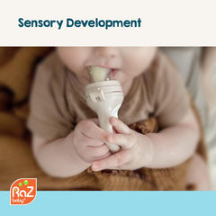 RaZbaby feeder's ergonomic handle supports tiny hands during feeding