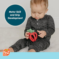 RaZbaby Bites strawberry-shaped teether designed for easy grasp by tiny hands