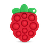 RaZbaby Razberry Pop strawberry teether held by a baby for easy grip during teething