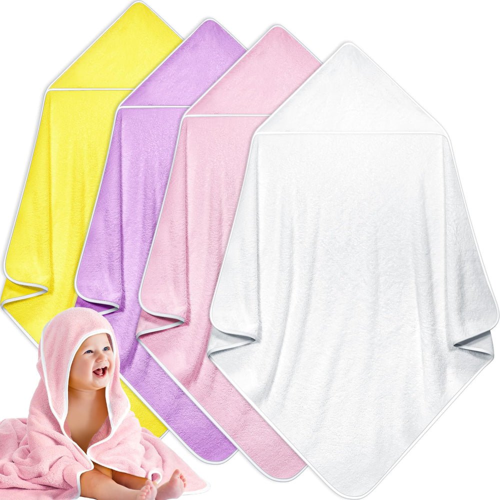 Reginary hooded baby towel close-up shows soft coral fleece for gentle drying.