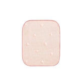 Reidio waterproof toddler mattress pad in peach protects against leaks for quick cleanup