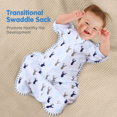 Baby wearing arms-up transition swaddle demonstrating comfortable self-soothing position