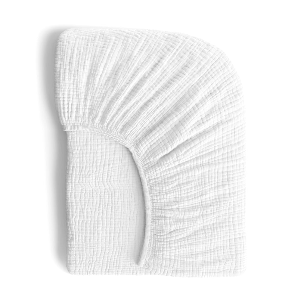 ROMY RO muslin crib sheet close-up texture, showing softness and breathability for delicate baby skin.