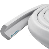 Roving Cove HeftyFit 6ft stone-grey edge guard on a sofa corner protecting children from sharp edges