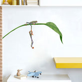 RoyoLam red-eyed tree frogs wall decal sheet adds playful color to a nursery.
