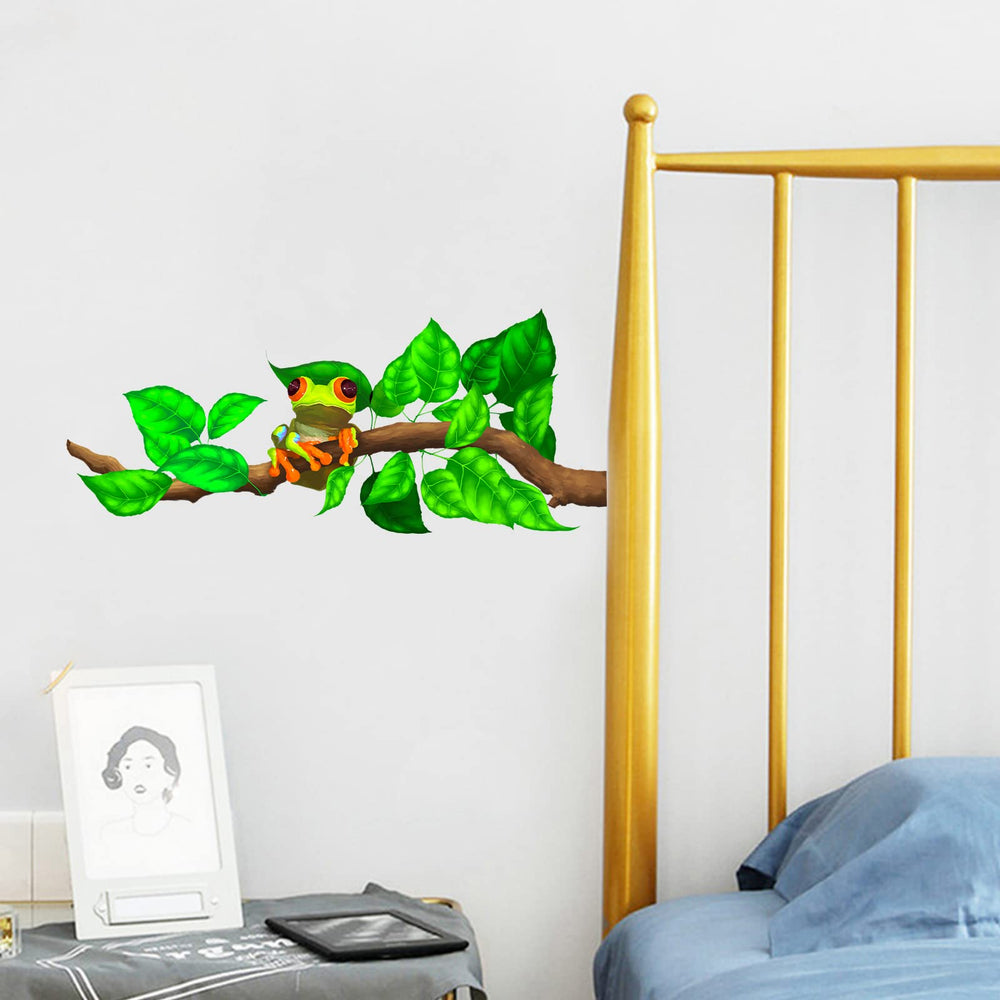 RoyoLam red-eyed tree frog wall decal on a branch adds playful charm to kids’ rooms.