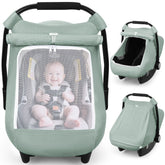 Rquiet car seat cover in green on a stroller, blocking sun and wind