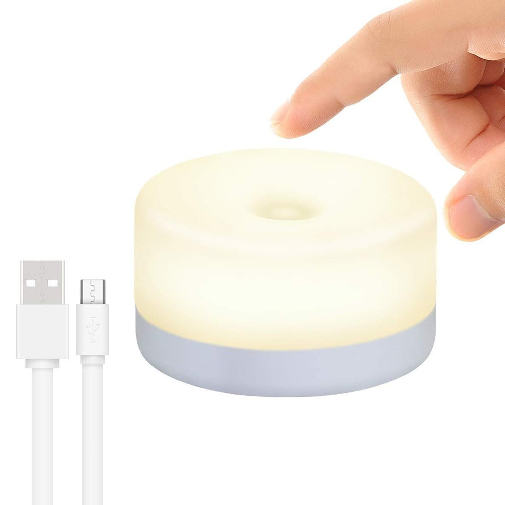RTSU rechargeable mini touch night light on a nightstand provides soft illumination.