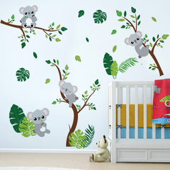 Runtoo Koala wall decal forest scene adds playful charm to a girl's bedroom.