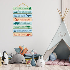 Rutiyoka wooden dinosaur signs with motivational words for kids’ nursery.