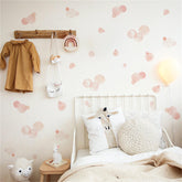 Sacinora pale pink polka dot wall stickers on a nursery wall showing playful decor