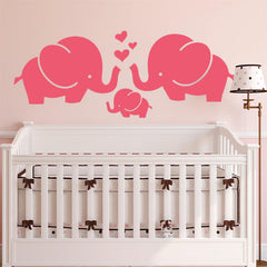 Sacinora pink baby elephant family wall sticker decorates a nursery wall with playful charm.