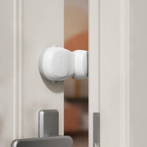 SAFELON astronaut door stopper demonstrates kid-safe design preventing finger pinches in doors