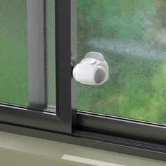Safelon baby window lock close-up showing secure adhesive mounting for childproofing.
