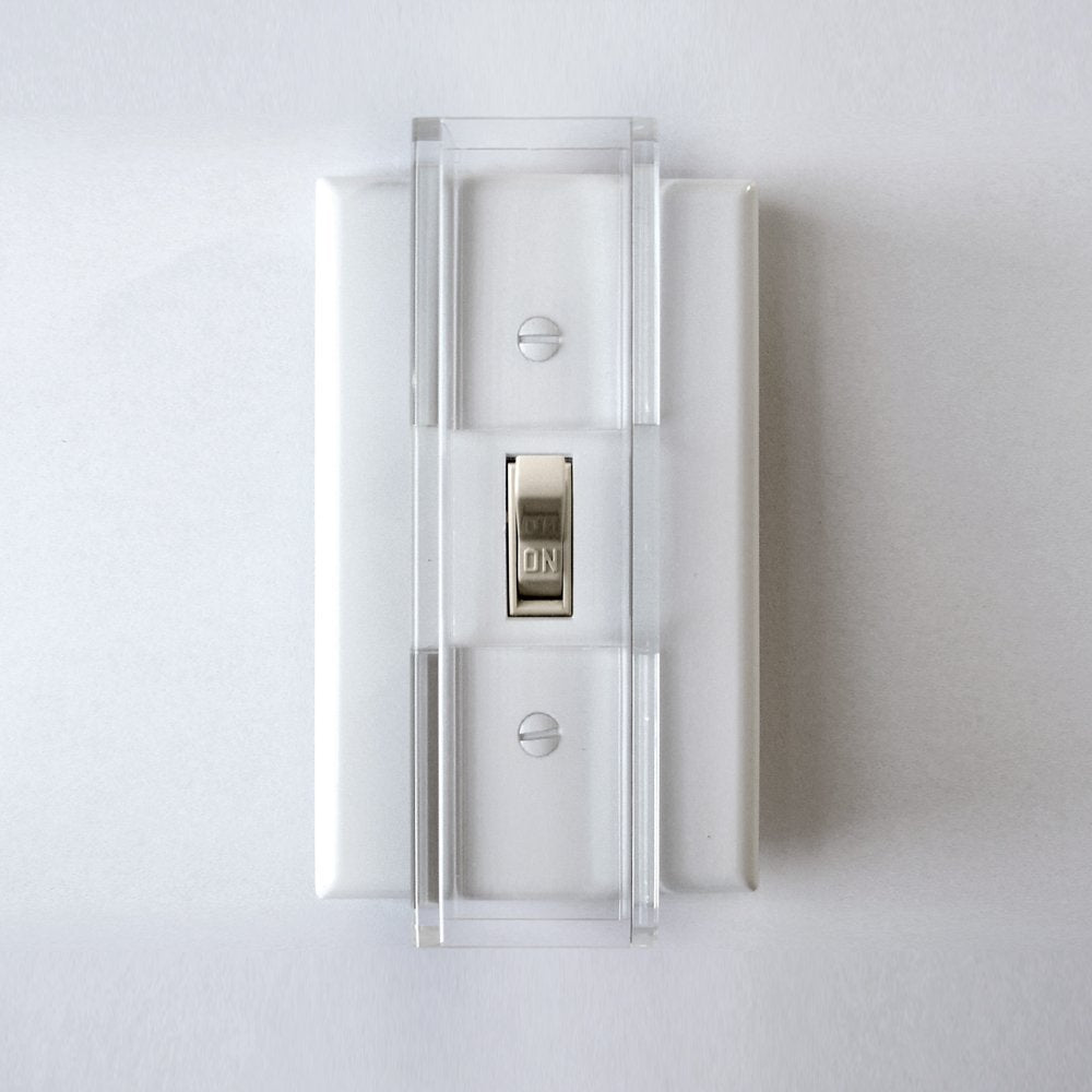 Safety Innovations child proof light switch guard installed on a standard toggle switch for safer play areas