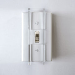 Safety Innovations child proof light switch guard installed on a standard toggle switch for safer play areas