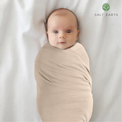 Salt Earth soft-organic-cotton swaddle blanket with gentle fabric for newborn skin.