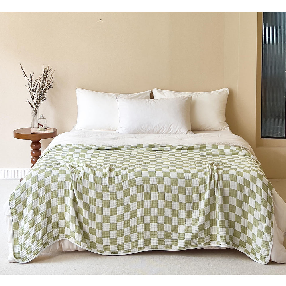 SANACYNA green grid blanket close-up weave highlighting breathable 6-layer muslin texture for baby comfort
