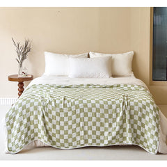 SANACYNA green grid blanket close-up weave highlighting breathable 6-layer muslin texture for baby comfort