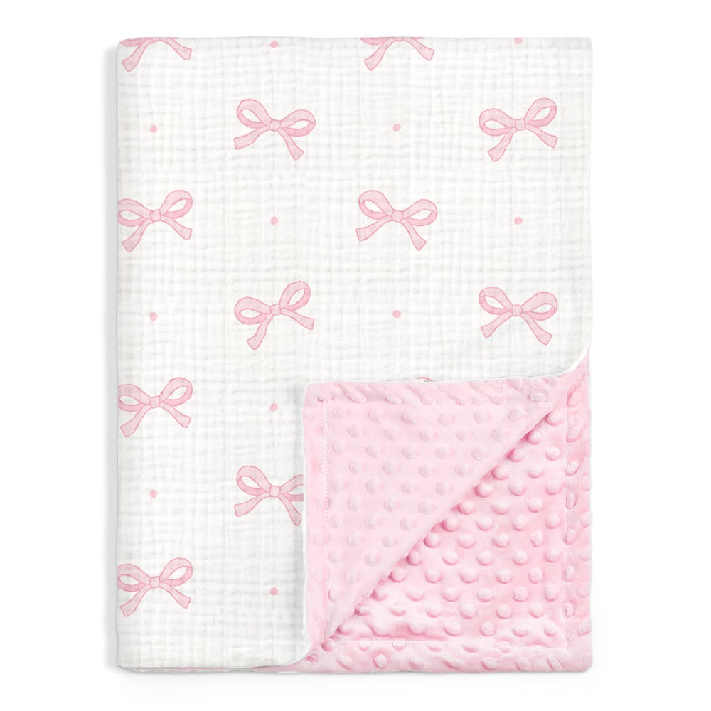 SANDJEST Bow Baby Blanket with muslin side for breathable, soothing comfort.