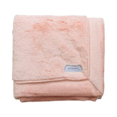 SARANONI luxury receiving blanket in peach blush for gentle baby cuddles and long-lasting warmth.