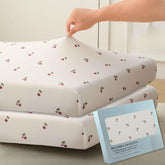 SDY jersey cherry crib sheets in pink design; soft and breathable for naps.