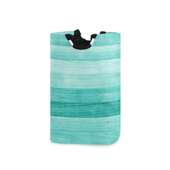 Senya large storage basket with handles in teal for easy transport.