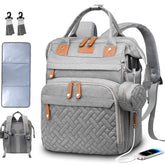 SHITIESHOU diaper bag backpack on shoulder displaying roomy layout for mom and baby.